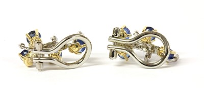 Lot 135 - A pair of two colour gold sapphire and diamond clip earrings