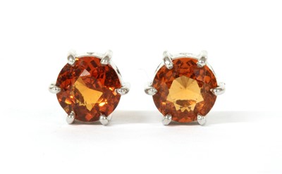 Lot 186 - A pair of white gold single stone hessonite garnet earrings