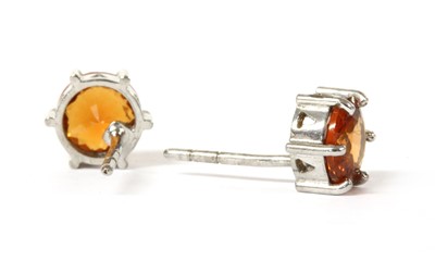 Lot 186 - A pair of white gold single stone hessonite garnet earrings