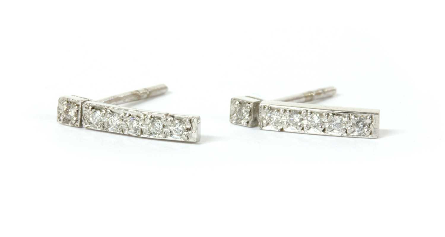 Lot 81 - A pair of 18ct white gold diamond set bar earrings