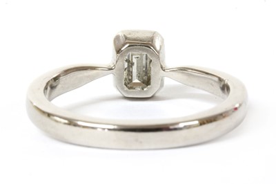 Lot 77 - A white gold single stone emerald cut diamond ring