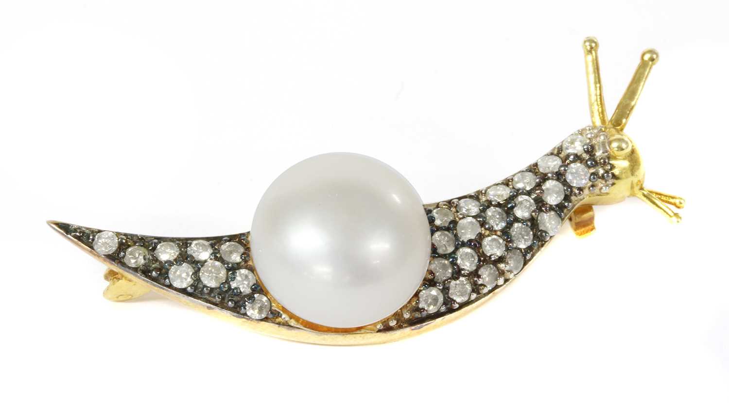 Lot 210 - A silver cultured freshwater pearl and diamond snail brooch