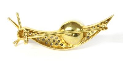 Lot 210 - A silver cultured freshwater pearl and diamond snail brooch