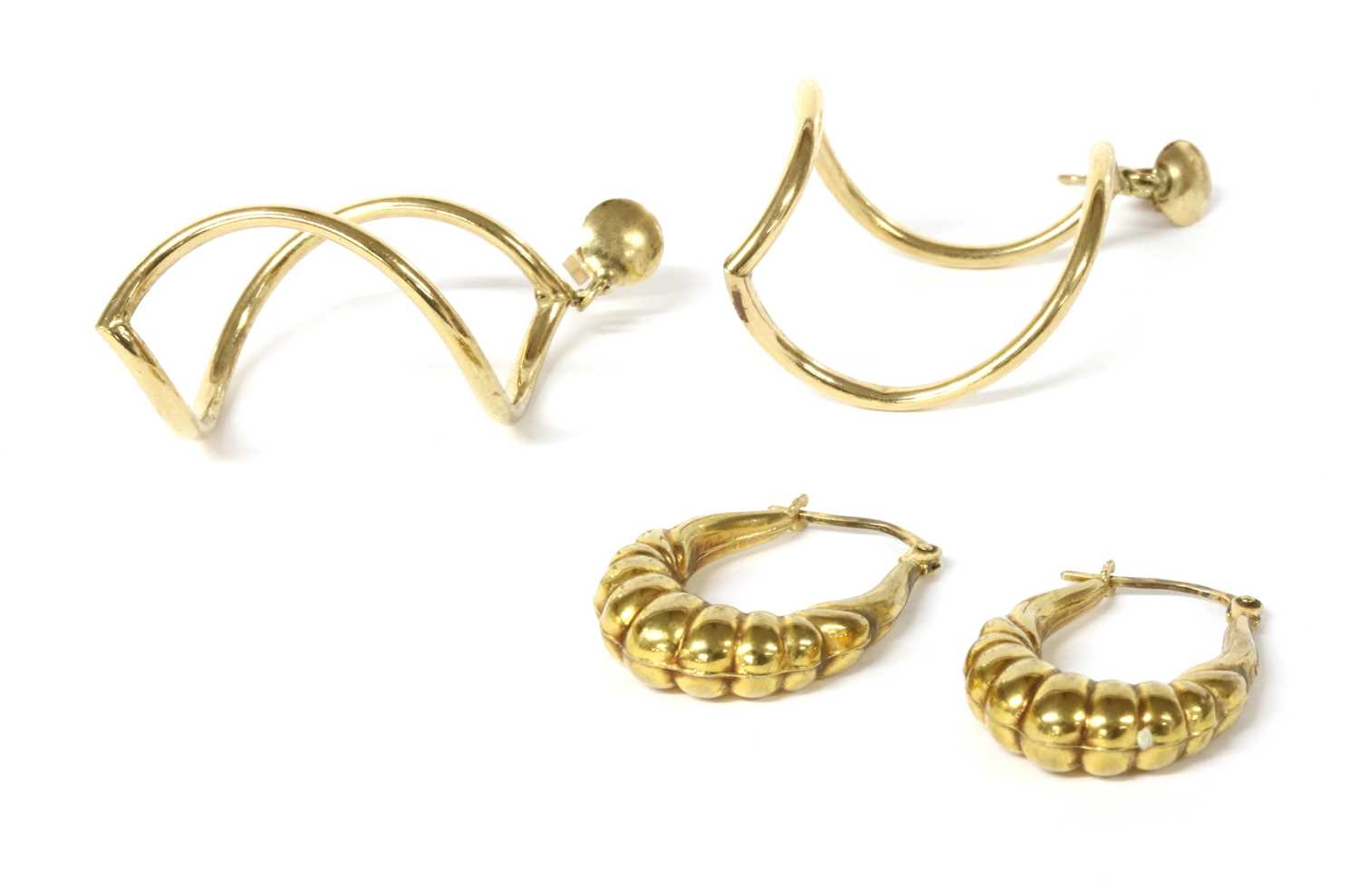 Lot 102 - A pair of gold hollow twist form drop earrings