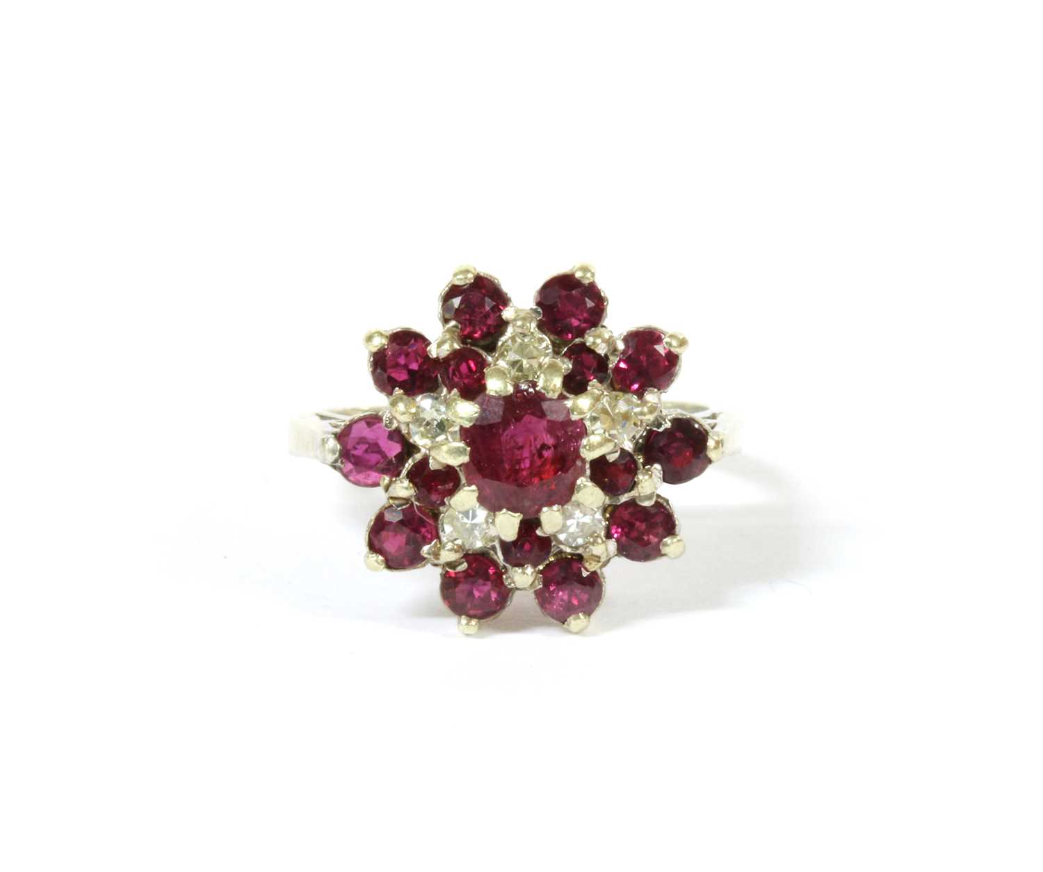 Lot 111 - A 9ct white gold ruby and diamond cluster ring