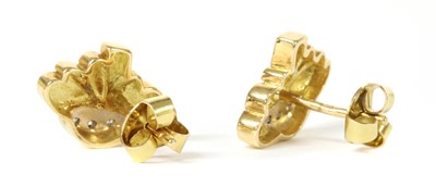 Lot 58 - A pair of 18ct gold diamond set daisy stud earrings