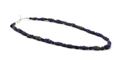 Lot 180 - A string of Bactrian lapis lazuli beads