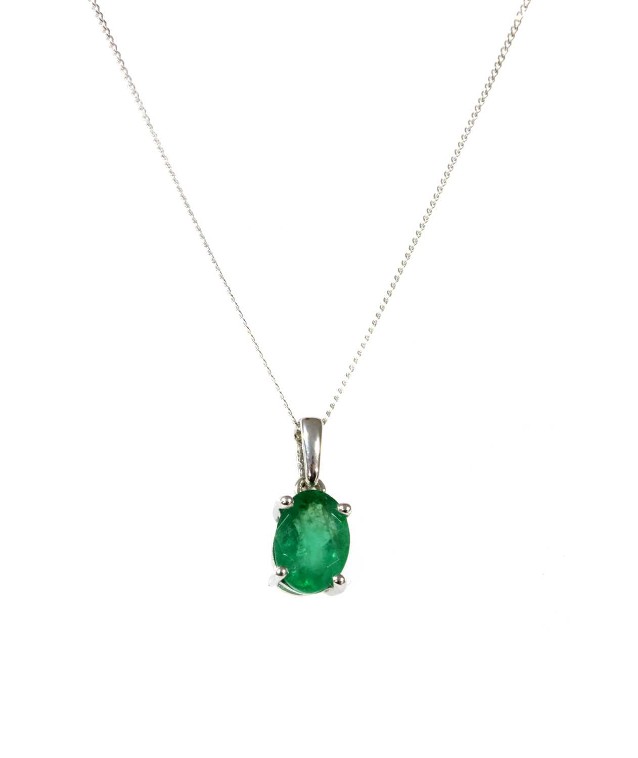 Lot 120 - A white gold single stone emerald pendant