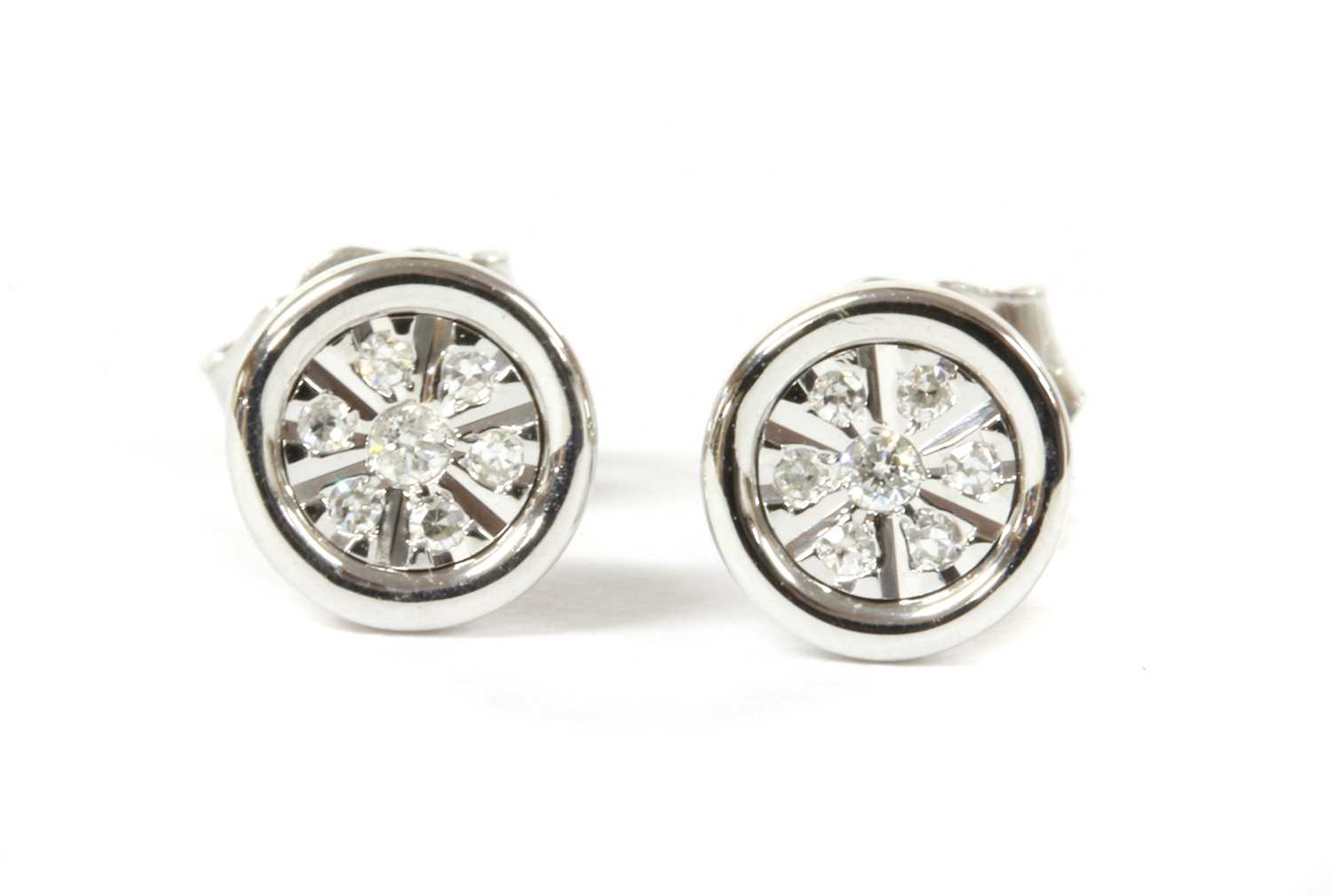 Lot 93 - A pair of white gold diamond earrings