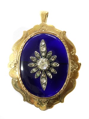 Lot 20 - A gold glass and diamond pendant/brooch