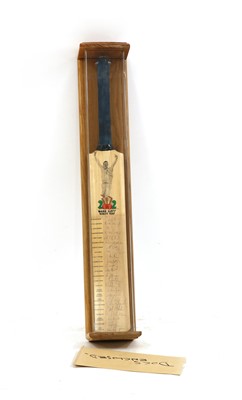 Lot 263 - A cased cricket bat