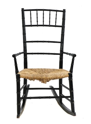 Lot 283 - An Aesthetic ebonised child's rocking chair