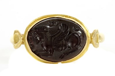 Lot 8 - A Byzantine gentlemen's high carat gold cabochon garnet intaglio ring