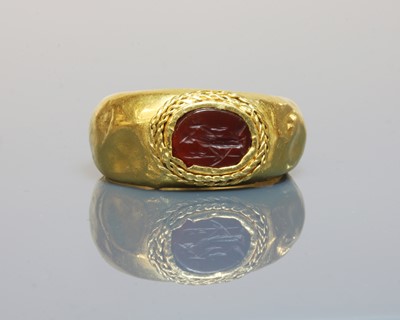 Lot 5 - A Roman gentlemen's high carat gold cornelian intaglio ring