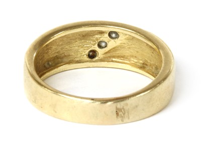Lot 49 - A gold three stone diamond ring