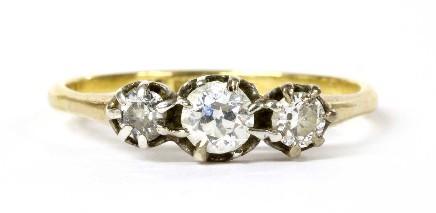 Lot 46 - A gold three stone diamond ring