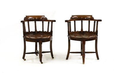 Lot 343 - A pair of late Victorian mahogany and elm elbow chairs