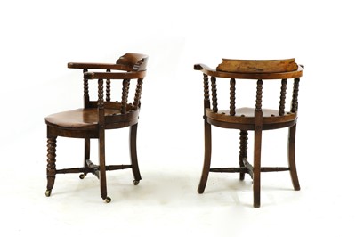 Lot 343 - A pair of late Victorian mahogany and elm elbow chairs