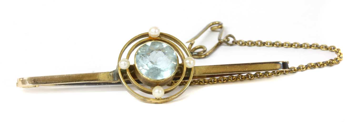 Lot 5 - A 9ct gold aquamarine and seed pearl brooch