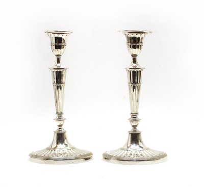 Lot 51 - A pair of Regency-style silver-plated candlesticks