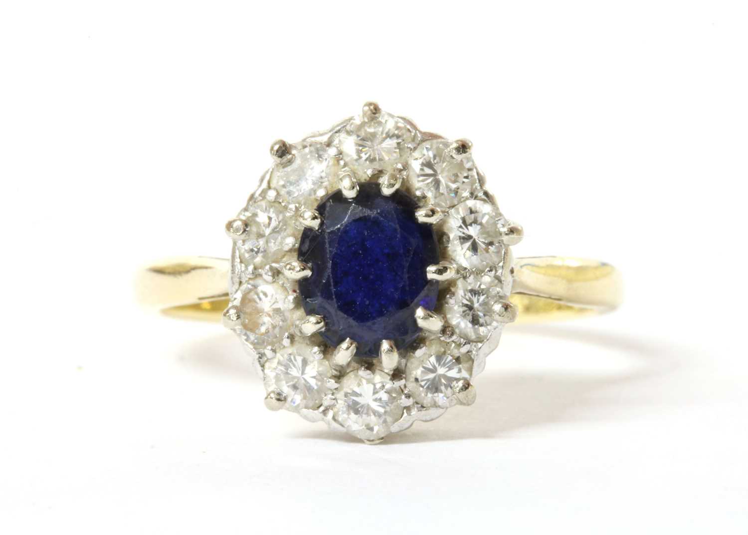 Lot 162 - A gold sapphire and diamond cluster ring