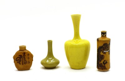Lot 137 - A collection of Chinese yellow glaze vases