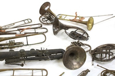 Lot 214 - A collection of French horns, saxophones and trombones