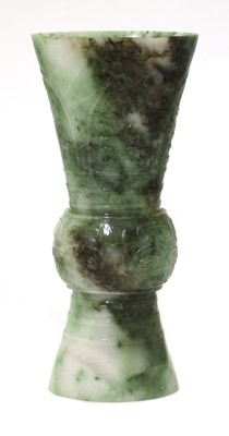 Lot 63 - A Chinese jade gu vase
