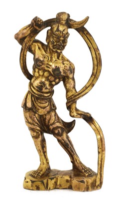 Lot 130 - A Chinese gilt-bronze figure