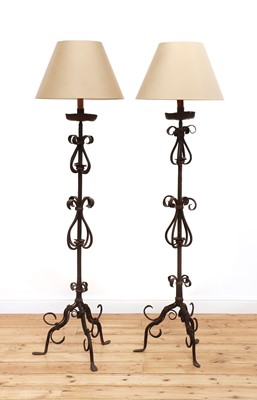 Lot 404 - A pair of wrought iron standard lamps