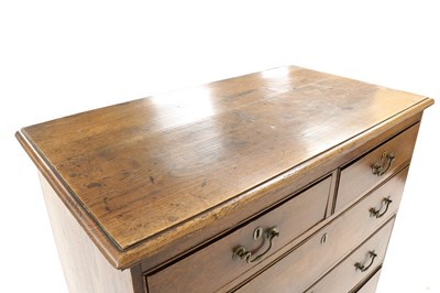 Lot 306 - An oak chest of two short over three long drawers