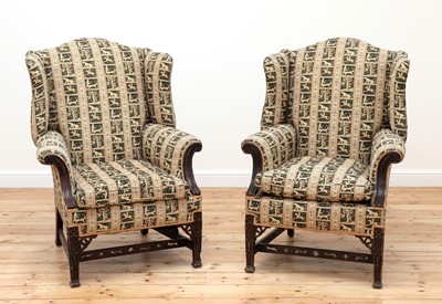 Lot 457 - A pair of George III-style mahogany wingback armchairs