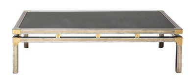 Lot 557 - A chrome and brass coffee table