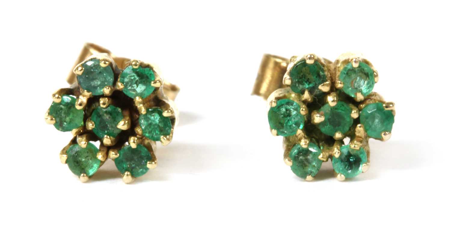Lot 124 - A pair of gold emerald cluster earrings