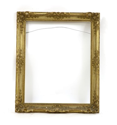 Lot 315 - A 19th century gilt gesso scroll moulded and swept portrait frame