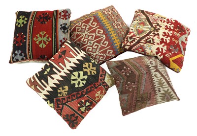 Lot 693 - A group of five kilim-covered cushions