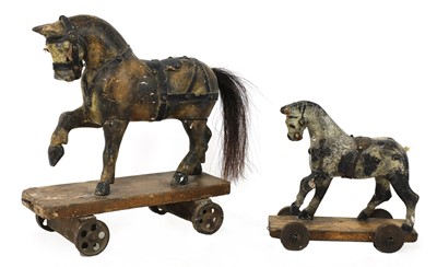 Lot 677 - A folk art pull-along toy horse