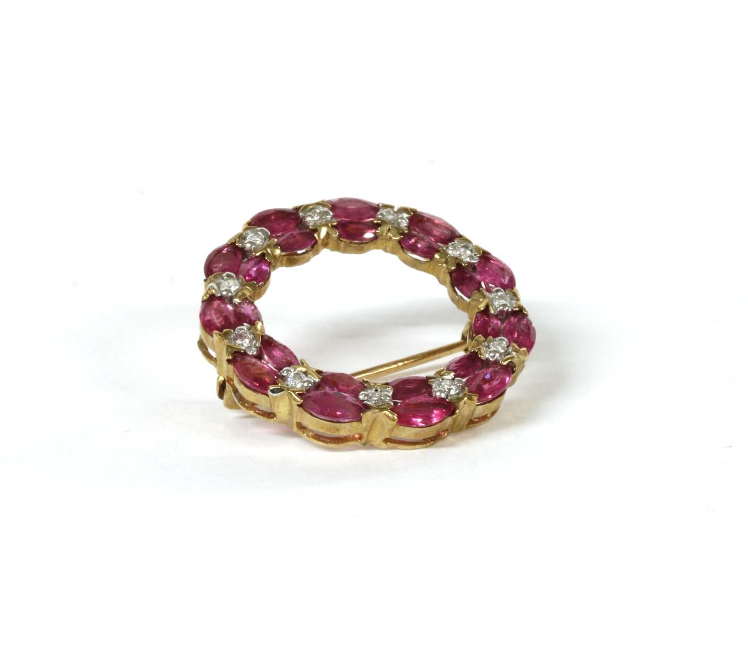 Lot 140 - A 9ct gold ruby and diamond wreath brooch