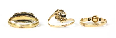 Lot 227 - A gold three stone garnet ring