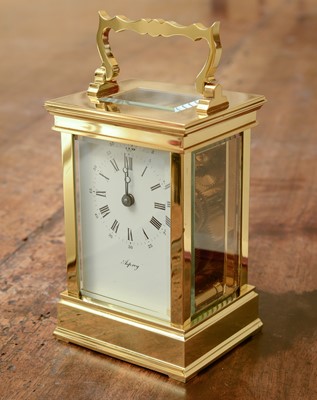 Lot 243 - A brass carriage clock