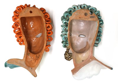 Lot 126 - Two Goldscheider pierced eye pottery wall masks