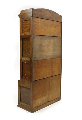 Lot 252 - An oak Lebos four-section bookcase
