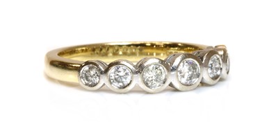 Lot 330 - An 18ct two colour gold seven stone graduated diamond ring