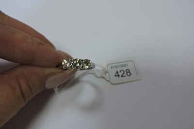 Lot 428 - An 18ct gold three stone diamond ring