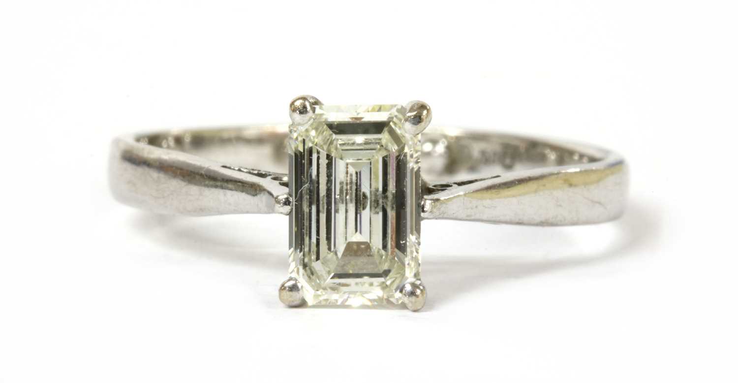 Lot 1195 - An 18ct white gold single stone emerald cut diamond ring