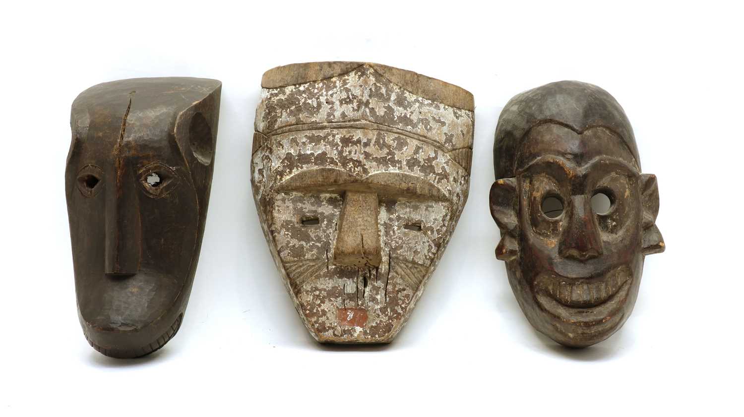 Lot 91 - Three carved tribal masks