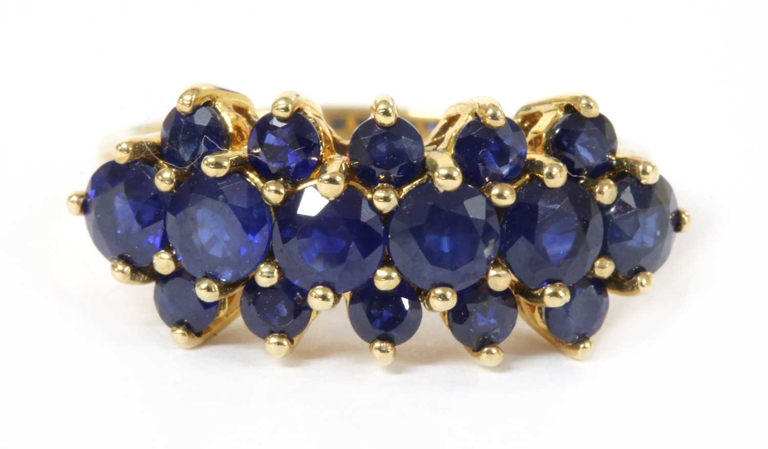 Lot 166 - A 9ct gold three row sapphire ring