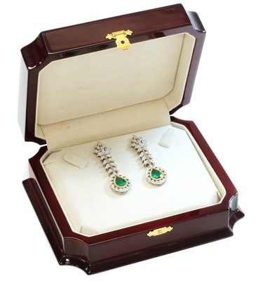 Lot 345 - A pair of two colour gold emerald and diamond drop earrings