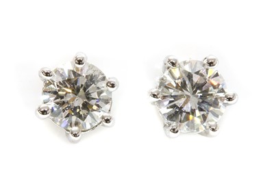 Lot 439 - A pair of single stone diamond stud earrings
