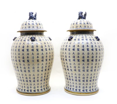 Lot 141 - A pair of large baluster form Chinese modern blue and white lidded vases